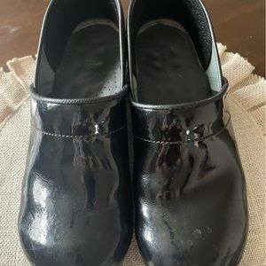 Black Sanita clogs.
